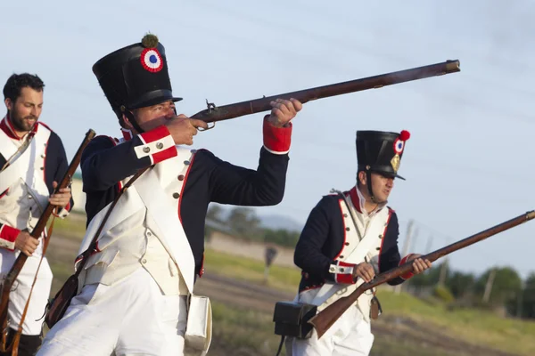 Soldiers fire muskets — Stock Photo, Image