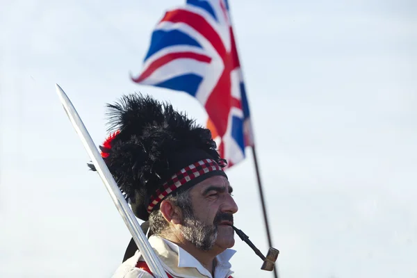 Portrait of scottish officer with flag — Stock Photo, Image