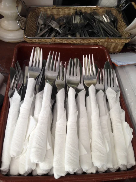 Forks covered with paper napkins — Stock Photo, Image