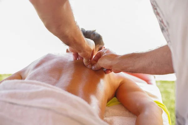 Massage therapist in action — Stock Photo, Image