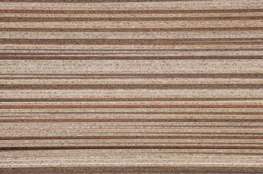 Parçacık tahtaları üst üste yığılmış. Kenarlık ayrıntılarını kapat