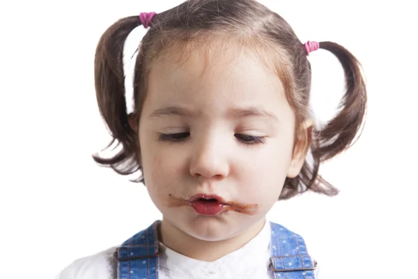 Portrait of happy girl after eating chocolate — Stock Photo, Image