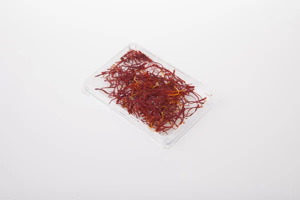 Little plastic box of spanish Saffron — Stock Photo, Image