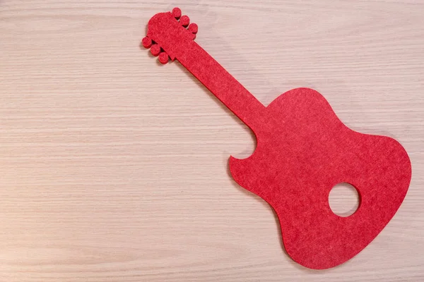 Sylwetka Gitary Wyciętej Poliestru Akustycznego Teksturowanym Tle Tego Samego Materiału — Zdjęcie stockowe