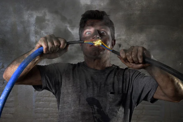 Untrained man joining cable suffering electrical accident with dirty burnt face shock expression — Stok fotoğraf