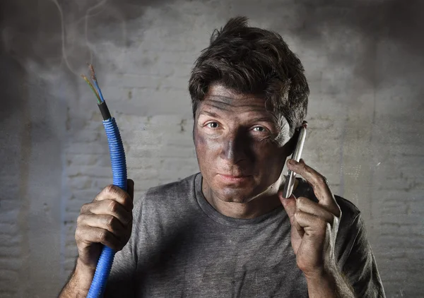 Young man calling for help after accident with dirty burnt face in funny sad expression — Stock Photo, Image