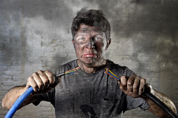 Untrained man joining cable suffering electrical accident with dirty burnt face shock expression — Stock Photo, Image