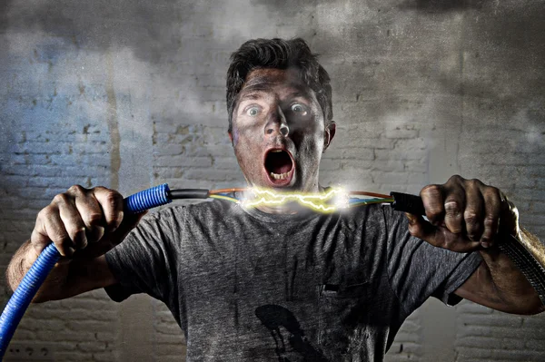 Untrained man joining cable suffering electrical accident with dirty burnt face shock expression — Stockfoto