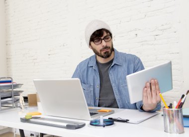 young hispanic attractive hipster businessman working at modern home office