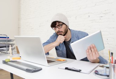 young hispanic attractive hipster businessman working at modern home office