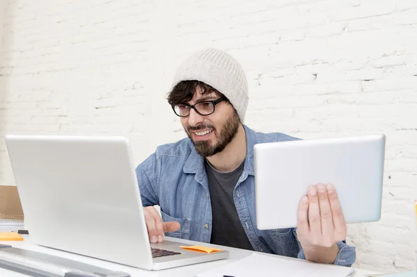 Young hispanic attractive hipster businessman working at modern home office — Stockfoto