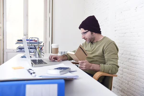 Young attractive hipster businessman working from his home office as freelancer self employed business model — Stockfoto