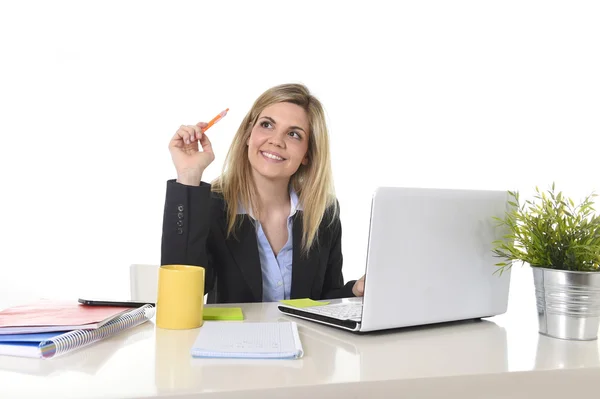 Happy Caucasian blond business woman working on laptop computer at modern office desk — Stock Photo, Image