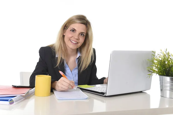 Happy Caucasian blond business woman working on laptop computer at modern office desk — Stock Photo, Image