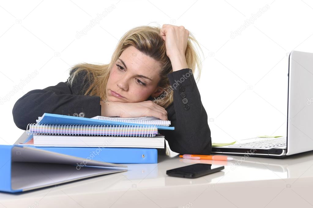 young beautiful business woman suffering stress working at office computer desk load of paperwork