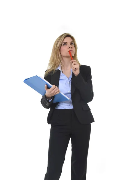 Young attractive and thoughtful business woman with blue folder and pen thinking about project — Stok fotoğraf