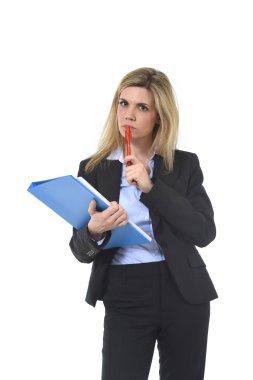 young attractive and thoughtful business woman with blue folder and pen thinking about project