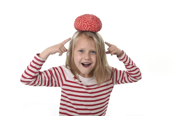 Young beautiful girl 6 to 8 years old playing with rubber brain having fun learning science concept — Stock Photo, Image