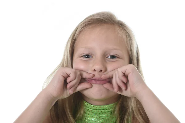 Cute little girl showing her lips in body parts learning school chart serie — Stock fotografie