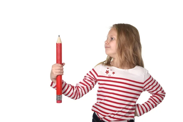 Sweet beautiful female child 6 to 8 years old  holding huge red pen school supplies concept — Stock Photo, Image