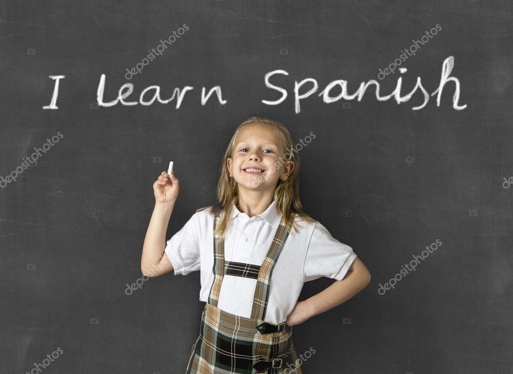 Sweet Junior Blond Schoolgirl Smiling Happy In Children Learning