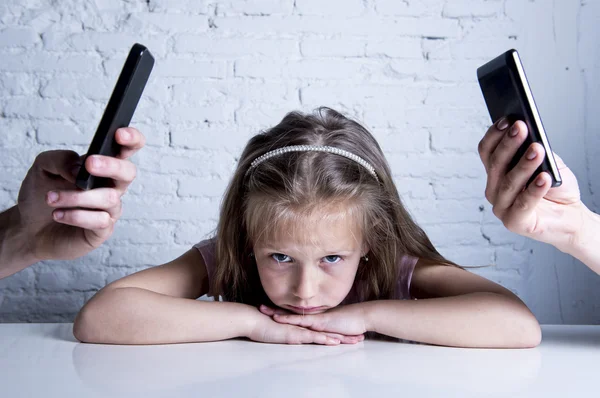 Hands of network addict parents using mobile phone neglecting little sad ignored daughter bored — Stock Photo, Image