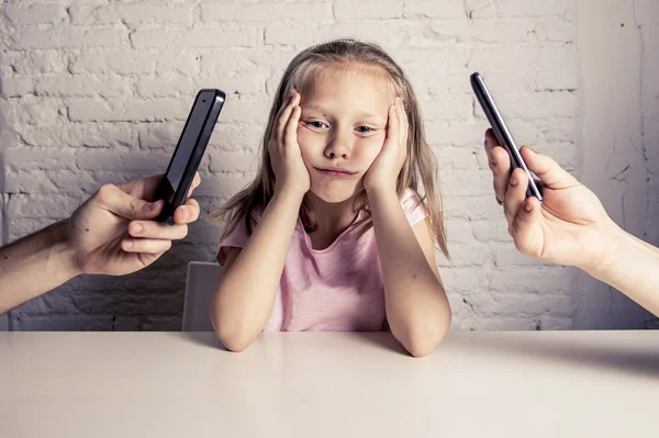 Hands of network addict parents using mobile phone neglecting little sad ignored daughter bored — Stock Photo, Image