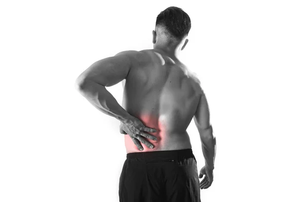 Young muscular body sport man holding sore low back waist are suffering pain in athlete stress — Zdjęcie stockowe