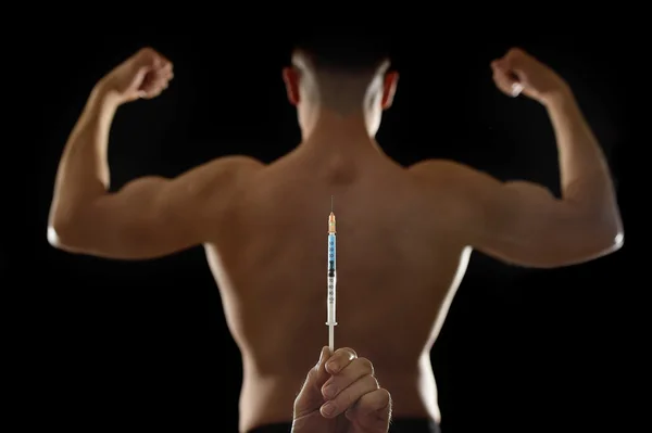 Stark rygg av unga Body Building Sportsman använda steroider för att öka sport prestationsförmågan — Stockfoto