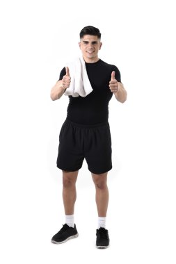 young attractive sport man fit strong body giving thumb up towel on shoulder smiling happy