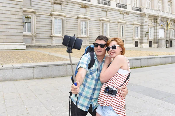 Young American couple enjoying Spain holiday trip taking selfie photo self portrait with mobile phone — Stock Photo, Image
