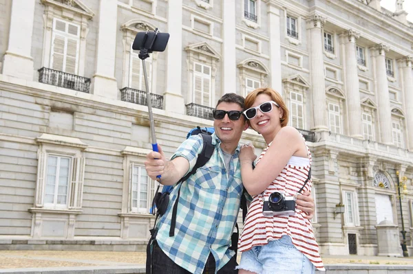 Young American couple enjoying Spain holiday trip taking selfie photo self portrait with mobile phone — Stock Photo, Image