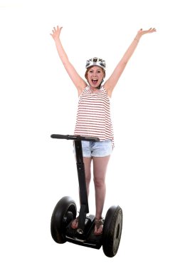 young tourist woman wearing safety helmet rising arms up hands free smiling happy riding electrical segway