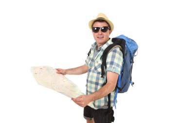 young tourist man reading city map looking relaxed and happy carrying backpack wearing summer hat
