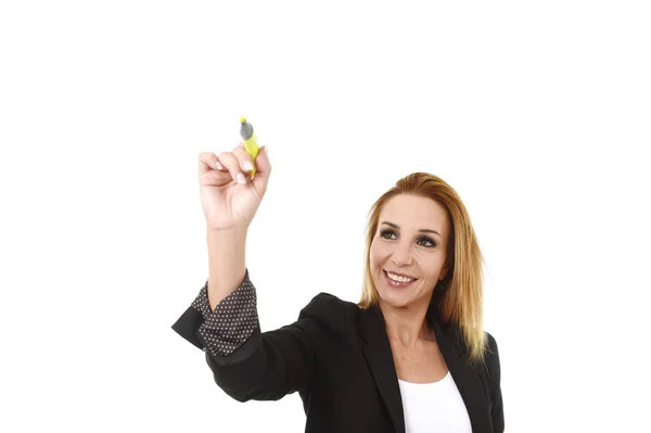 Attractive blond successful businesswoman holding marker writing on transparent board — Stock Photo, Image