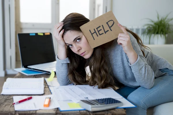 Young woman asking for help suffering stress doing domestic accounting paperwork bills — Stock fotografie