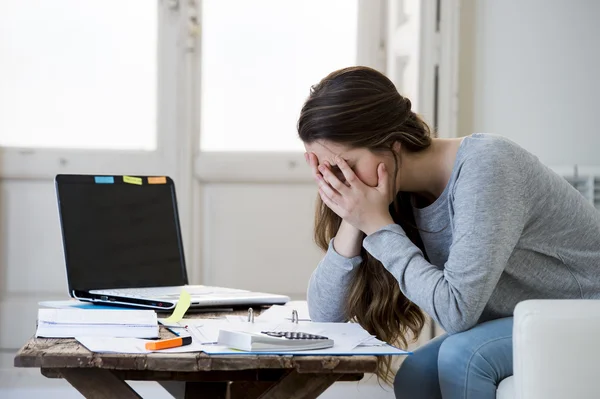 Worried woman suffering stress doing domestic accounting paperwork bills and invoices — Stok fotoğraf