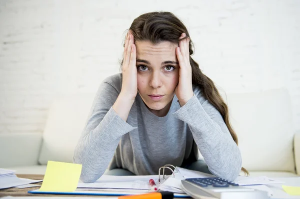 Young worried woman suffering stress doing domestic accounting paperwork bills — Stock fotografie