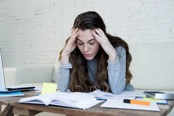 Young attractive and desperate woman suffering stress doing domestic accounting paperwork bills and invoices — 스톡 사진