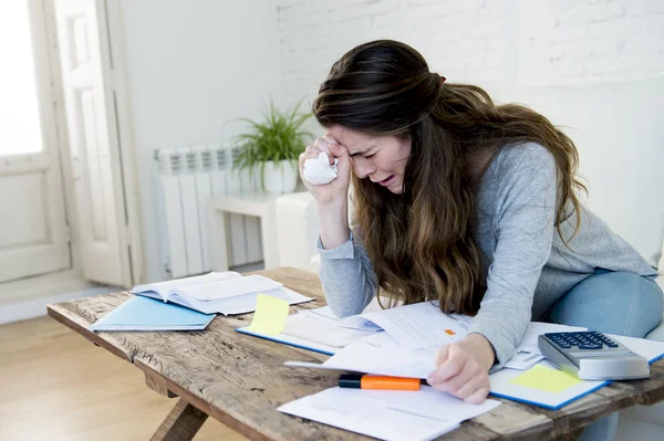 Young worried woman suffering stress doing domestic accounting paperwork bills — Stock fotografie