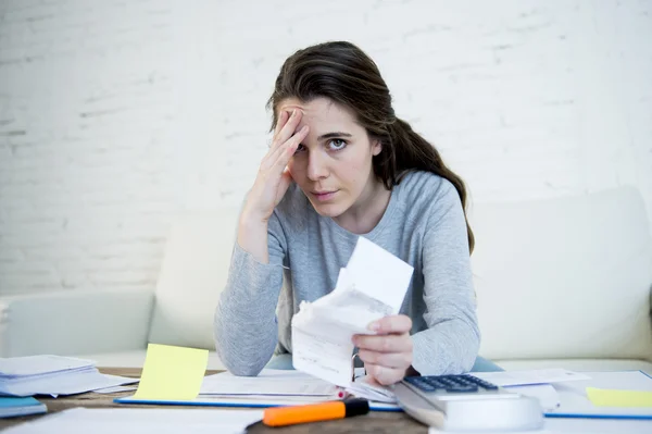 Young worried woman suffering stress doing domestic accounting paperwork bills — Stok fotoğraf