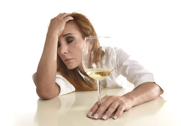 Caucasian blond wasted and depressed alcoholic woman drinking white wine glass desperate drunk — Stock Photo, Image