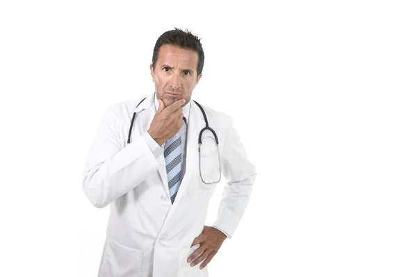 40s atractivo médico masculino con estetoscopio usando bata médica en preocupado y estrés —  Fotos de Stock