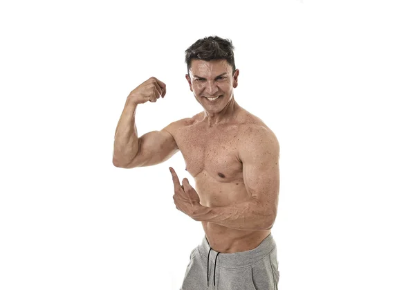 40s attractive hispanic sport man and bodybuilder posing corporate pointing  biceps — Stock Photo, Image