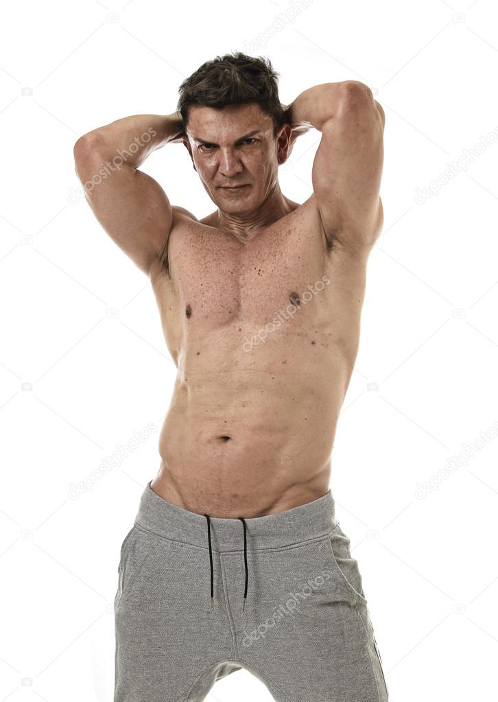 40s hispanic sport man and bodybuilder posing with naked torso showing