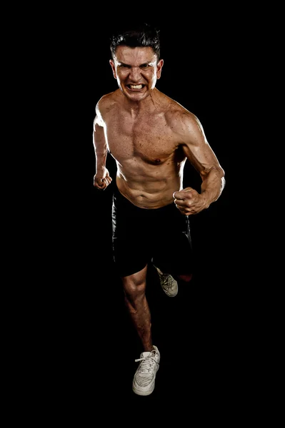 Stark vältränad man med rippade kropp muskler kör beslutsamma hårt gör sprint träning naken överkropp — Stockfoto