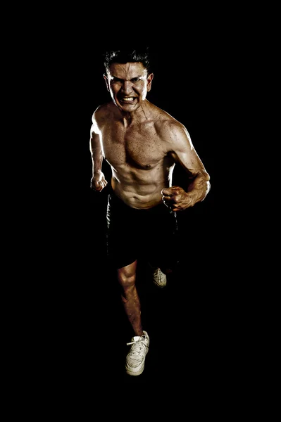 Fort ajustement homme avec déchiré corps muscles courir déterminé dur faire sprint séance d'entraînement torse nu — Photo