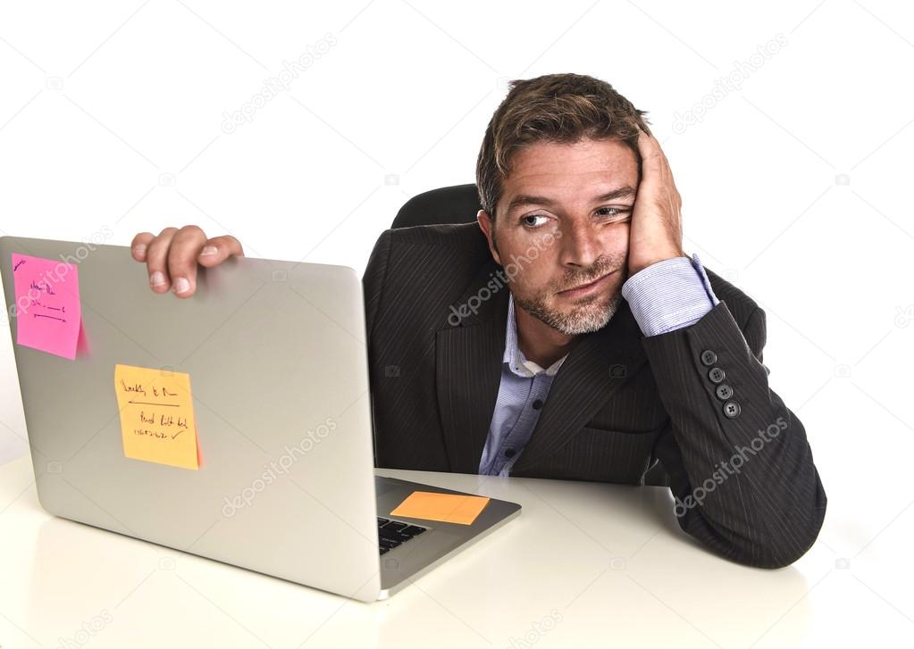 businessman looking worried suffering stress at office laptop computer having work problem