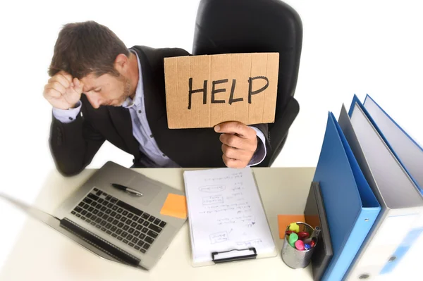 Young desperate businessman suffering stress working at office c — Stockfoto