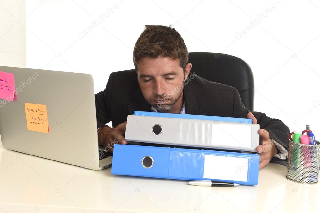 tired wasted businessman working in stress at office laptop computer exhausted overwhelmed